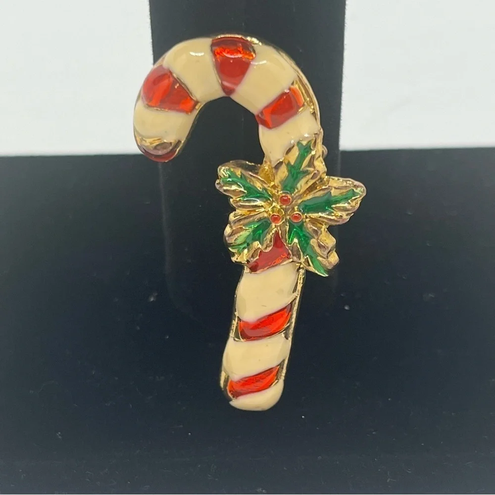 Vintage candy cane pin. Costume Jewelry Enamel, red and white green holly.